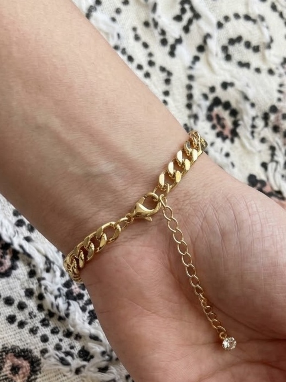 Gold wristlet comes in velvet pouch